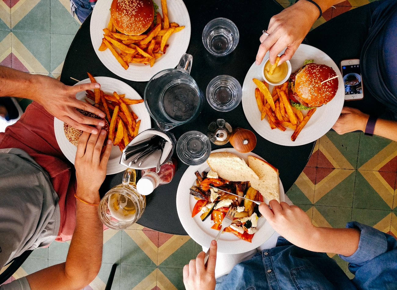 A table of friends sharing dishes