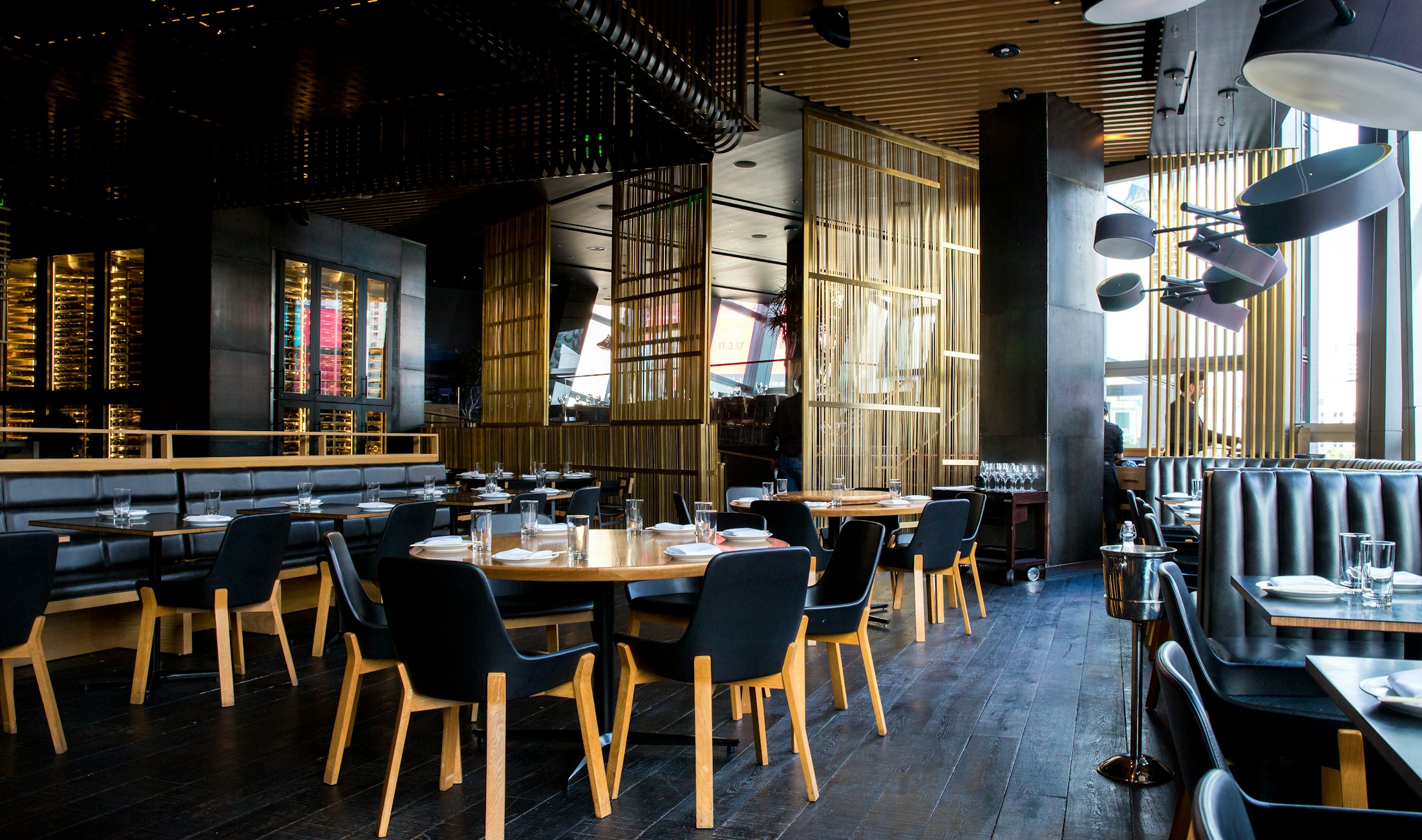 The warm, candle-lit dining room at Ember & Oak